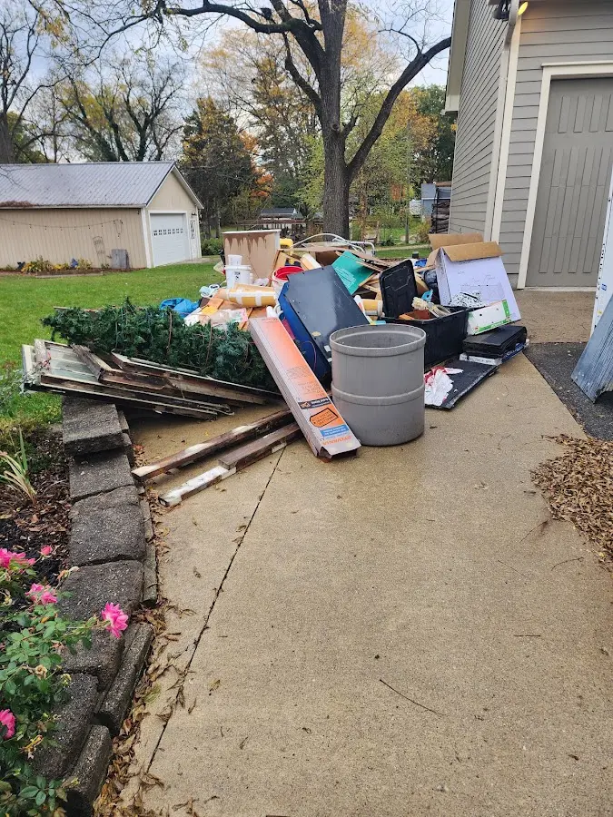 Dumpster being loaded with debris for Roofing Dumpster Rental in Elkland